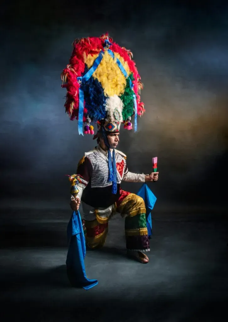 Dancer with feathered headdress at the Guelaguetza in Oaxaca